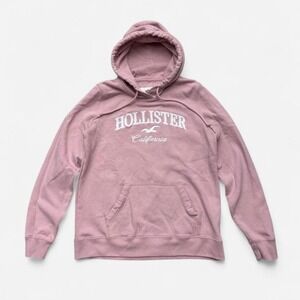 Pink Hollister Co. hoodie with white text reading HOLLISTER California, size M
